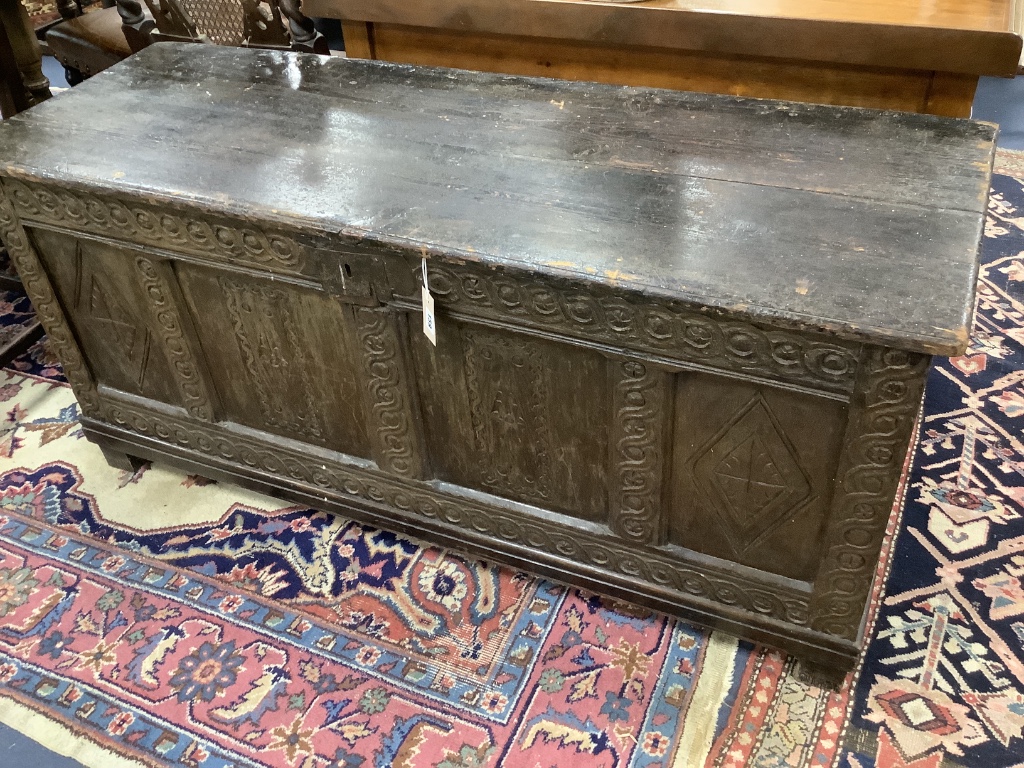 A 17th century oak coffer, length 142cm, depth 53cm, height 64cm